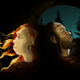Artist’s depiction of a Neanderthal female and male wearing jewelry made from eagle talons.